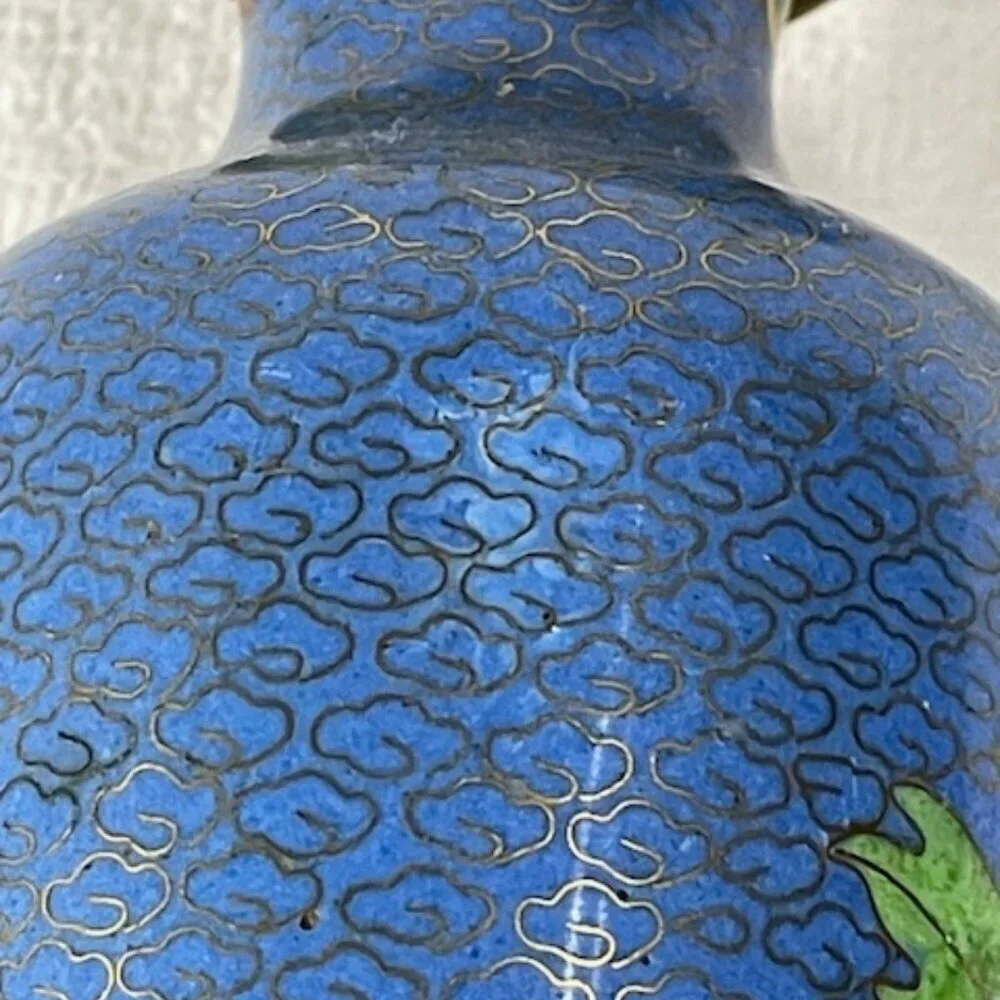 Chinese blue cloisonne and brass vase with wooden stand.